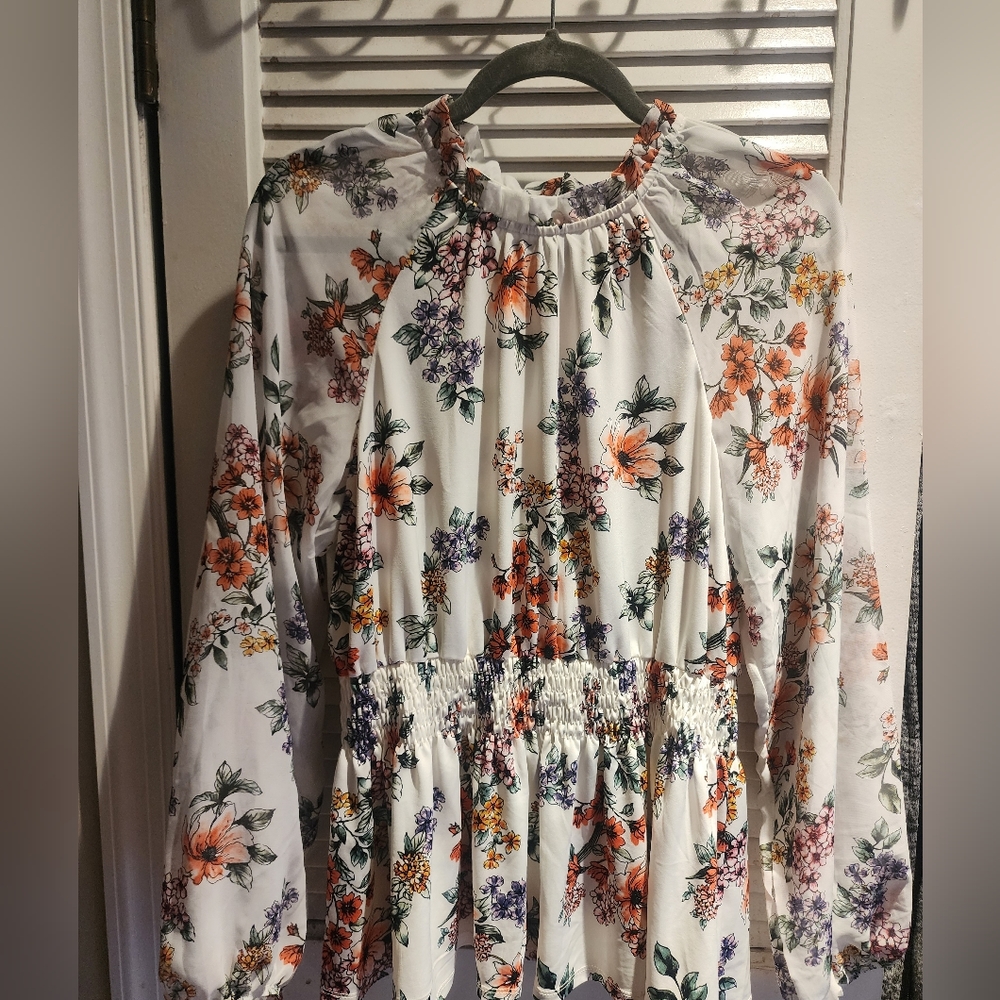 Long sleeved peplum style lightweight top
